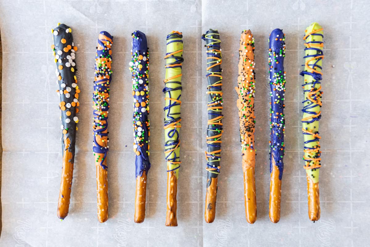 decorated Halloween Pretzel Rods in a line