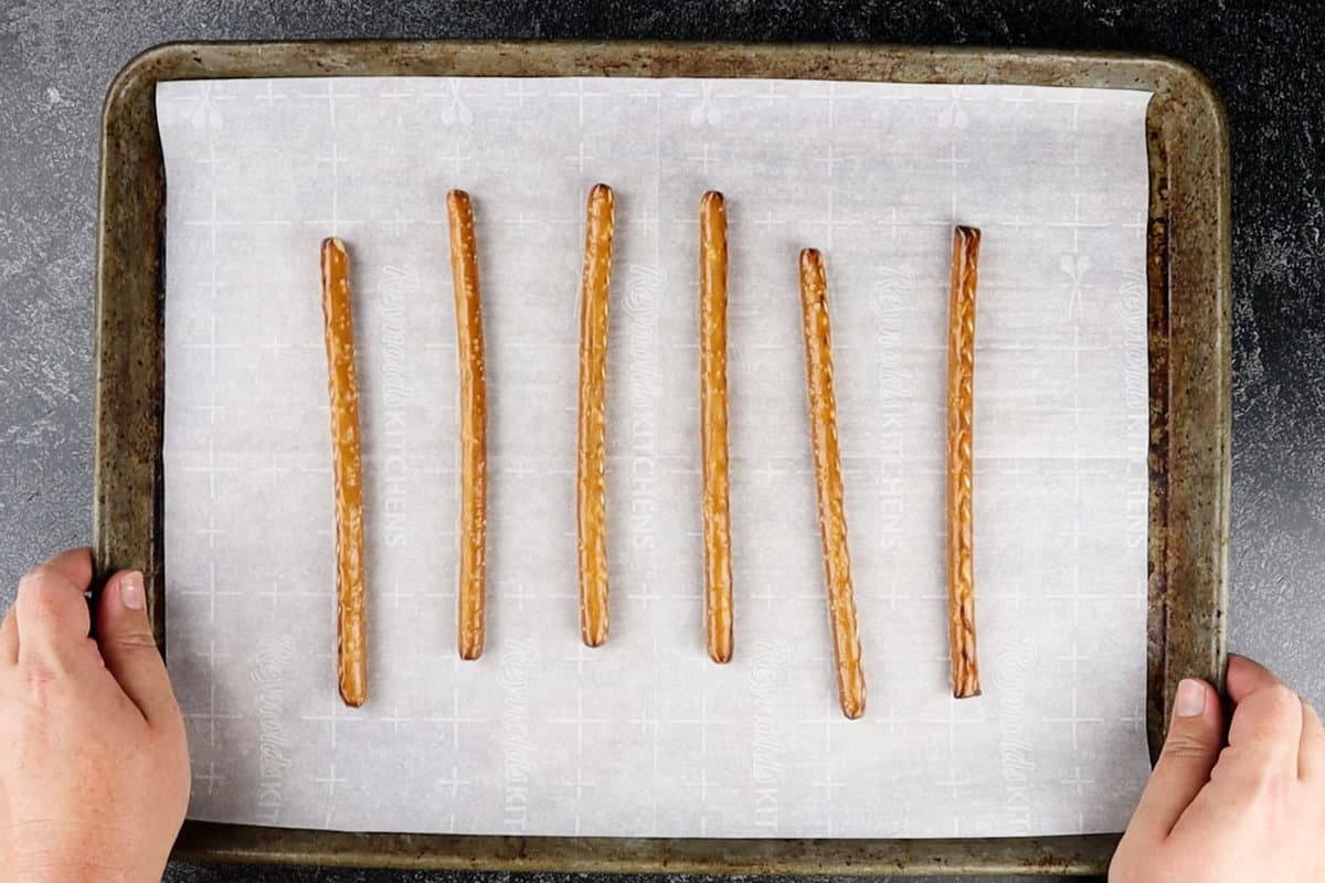 pretzel rods on parchment paper