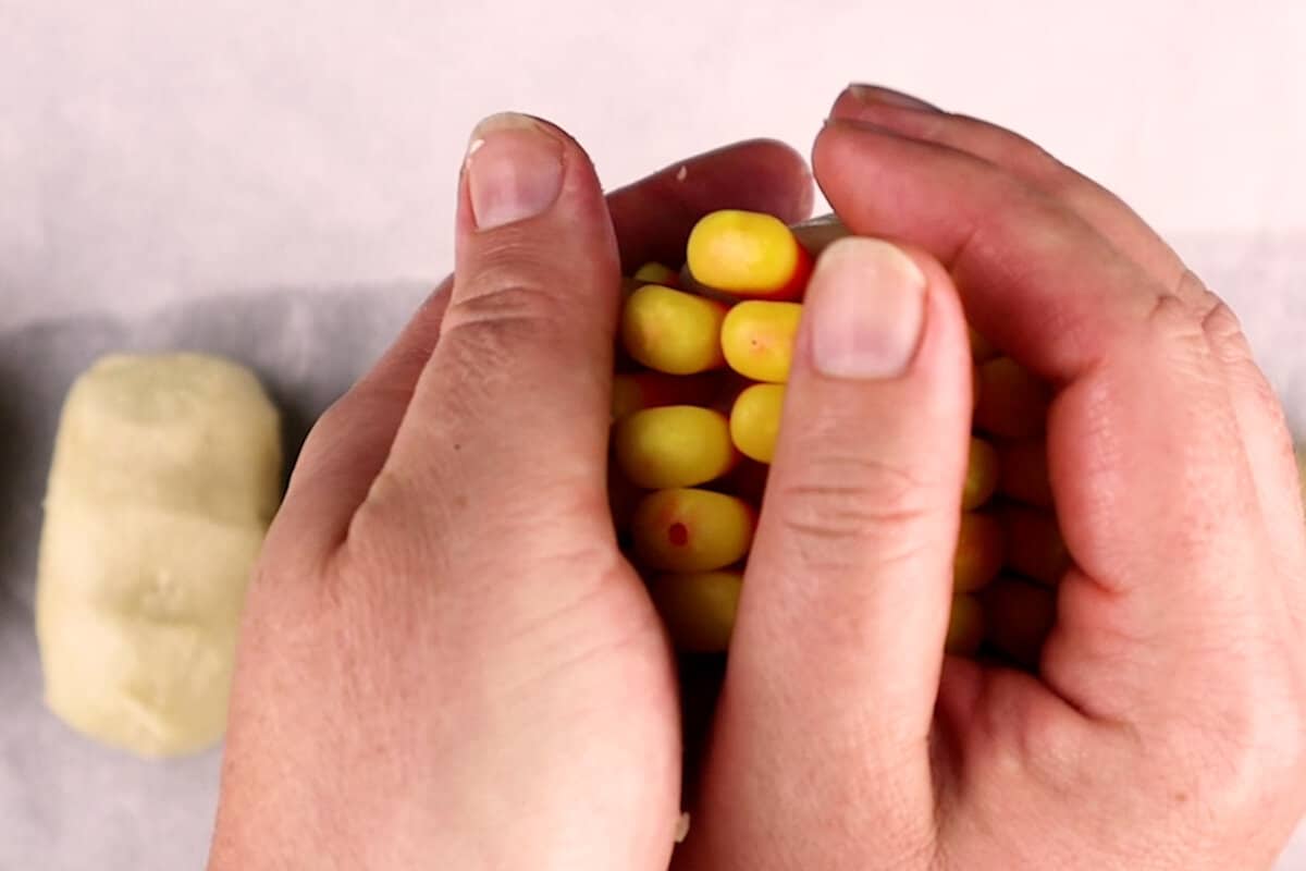 pressing/reshaping candy corn on the cob