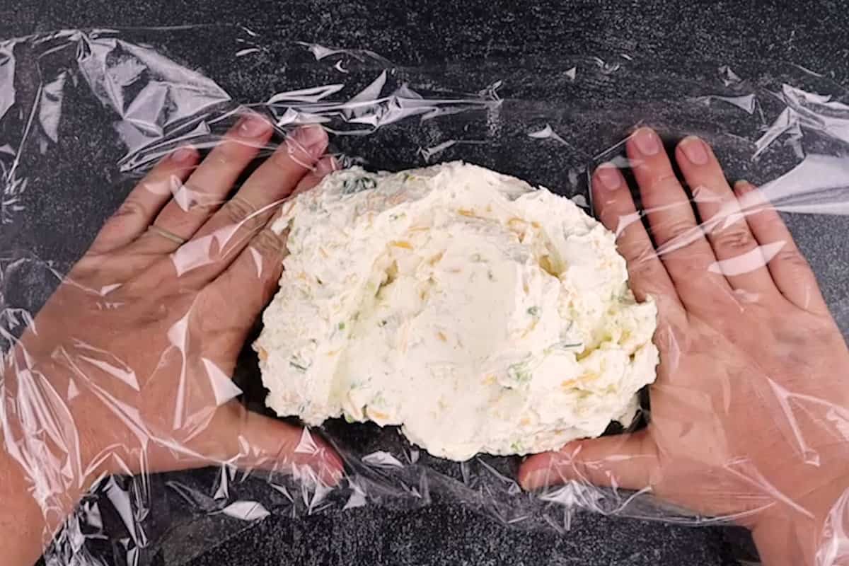 placing cream cheese in seran wrap