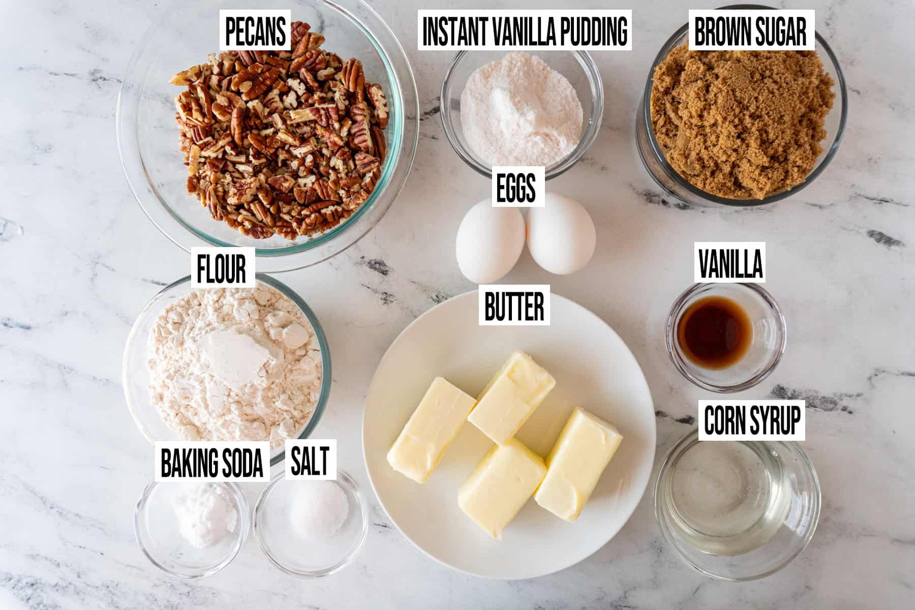 pecan pie cookie ingredients in individual bowls and labeled.