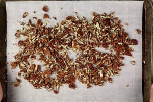 toasted pecans on baking sheet