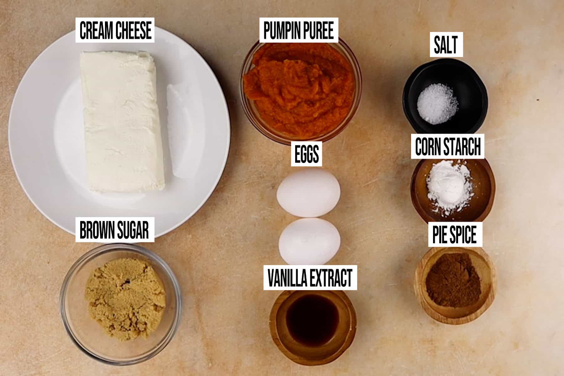 Mini Pumpkin Cheesecakes: Filling Ingredients in individual bowls and labeled.