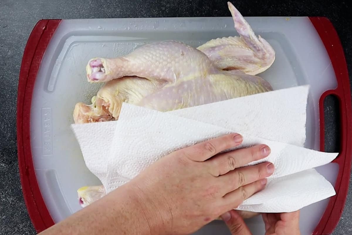 patting chicken dry