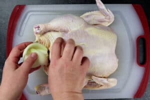 adding onion to chicken cavity