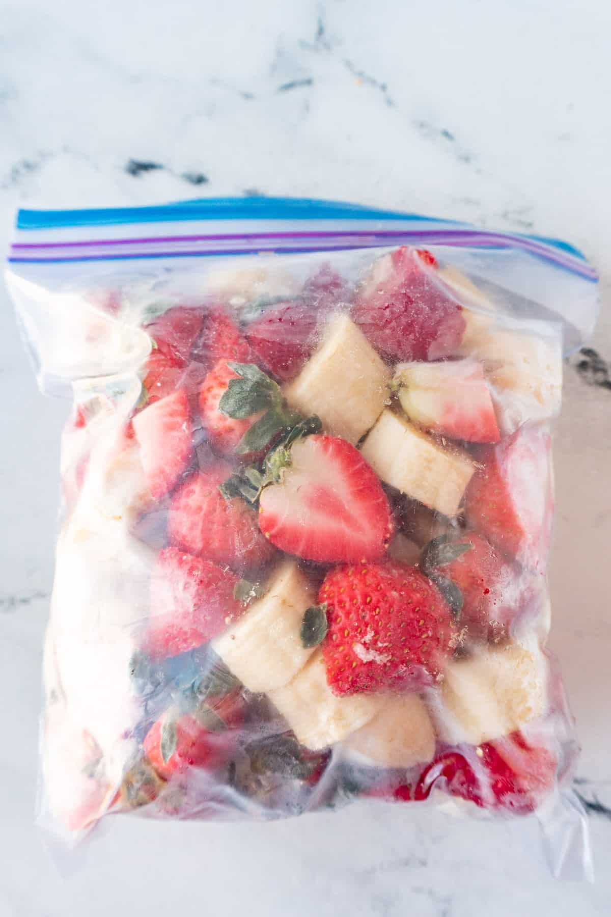 frozen banana strawberry mix in freezer bag