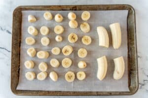 sliced bananas on baking sheet
