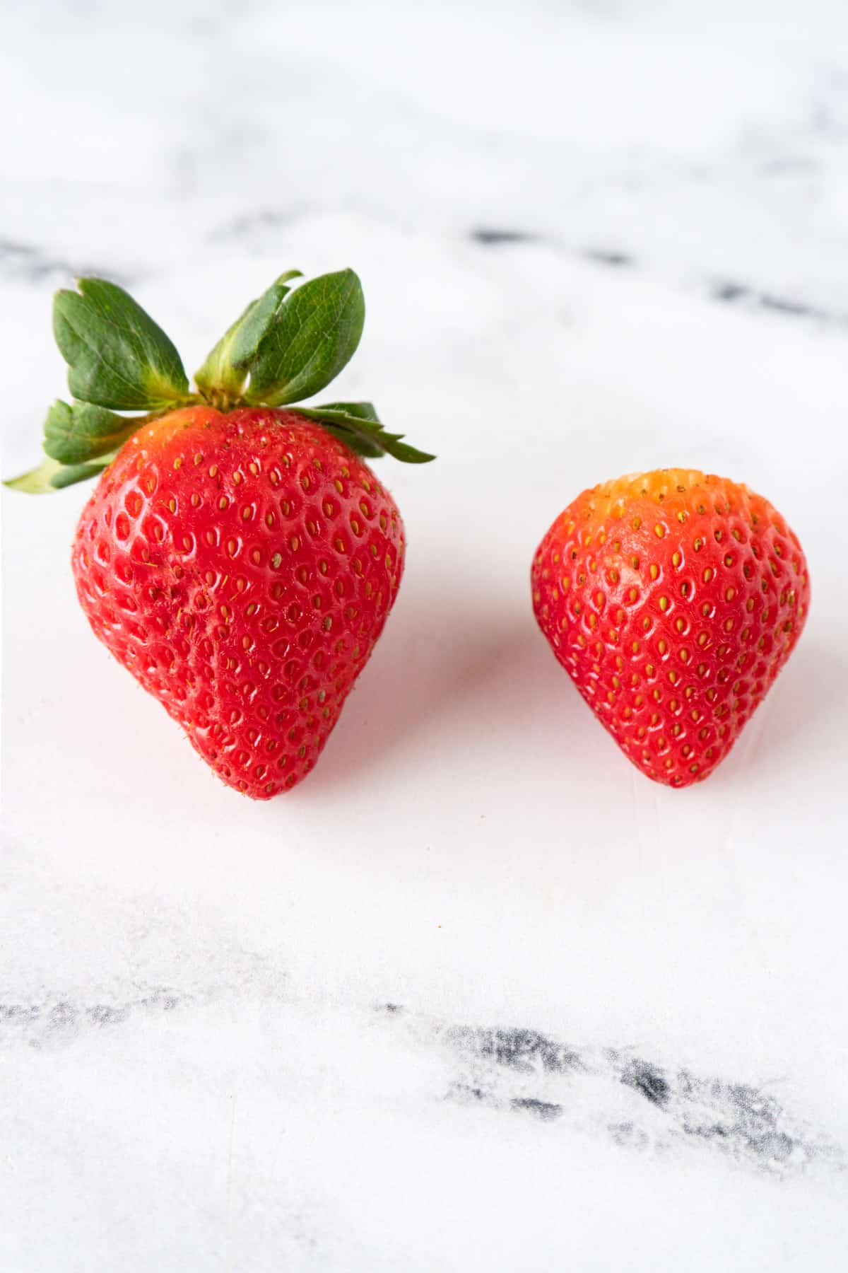 strawberries with and without green tops