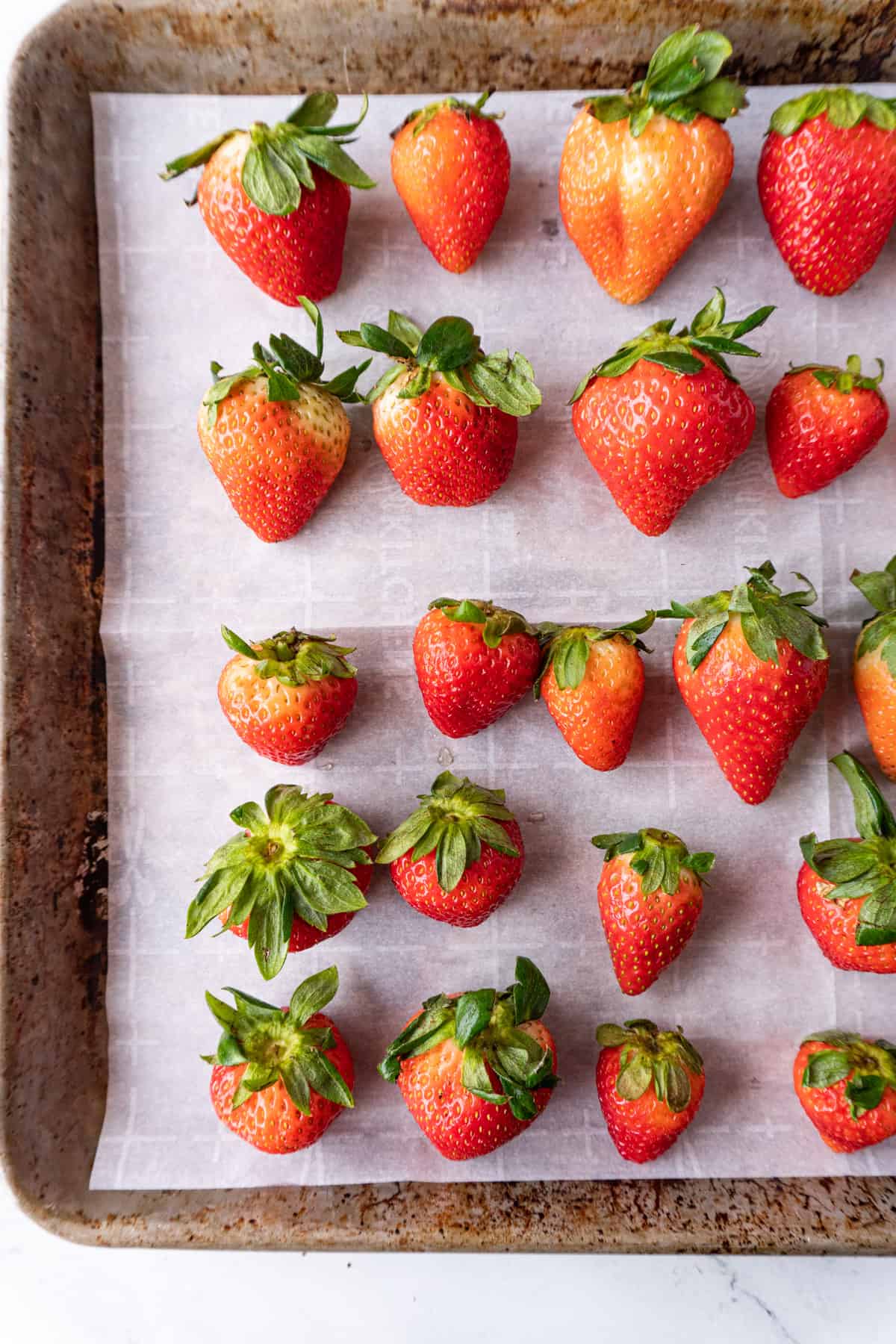 strawberries on baking sheet close up