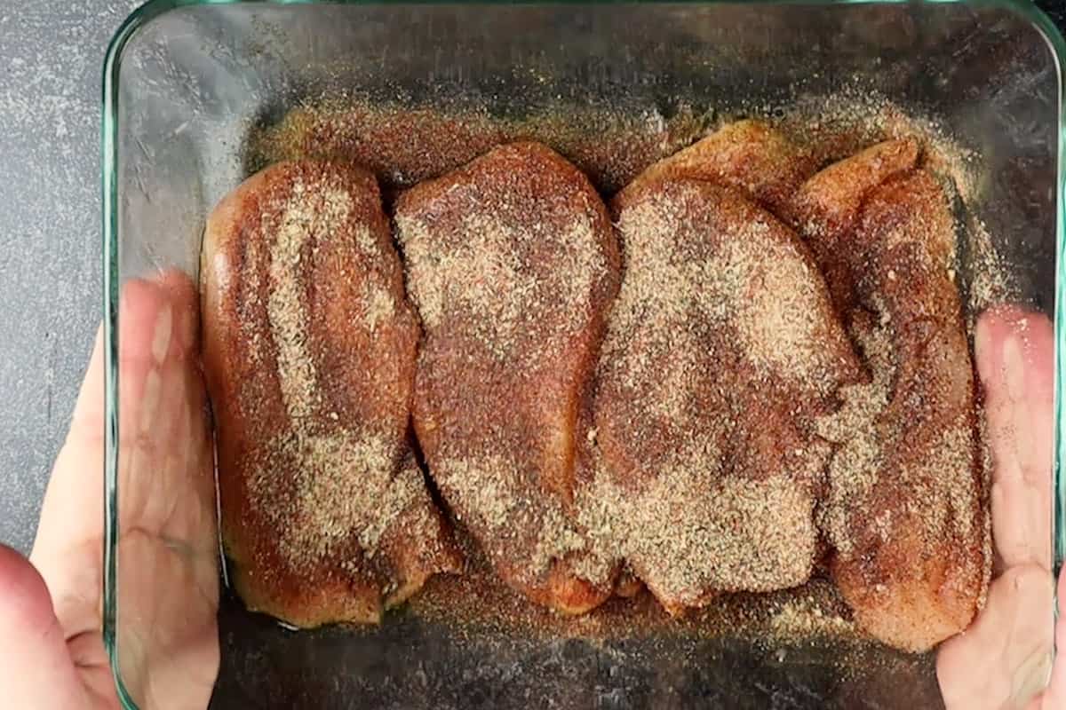 chicken breast with seasoning on it