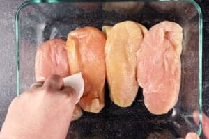 patting chicken breast dry