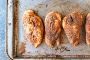 smoked chicken breast on baking sheet