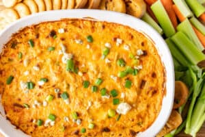 franks red hot buffalo chicken dip baked with veggies next to it