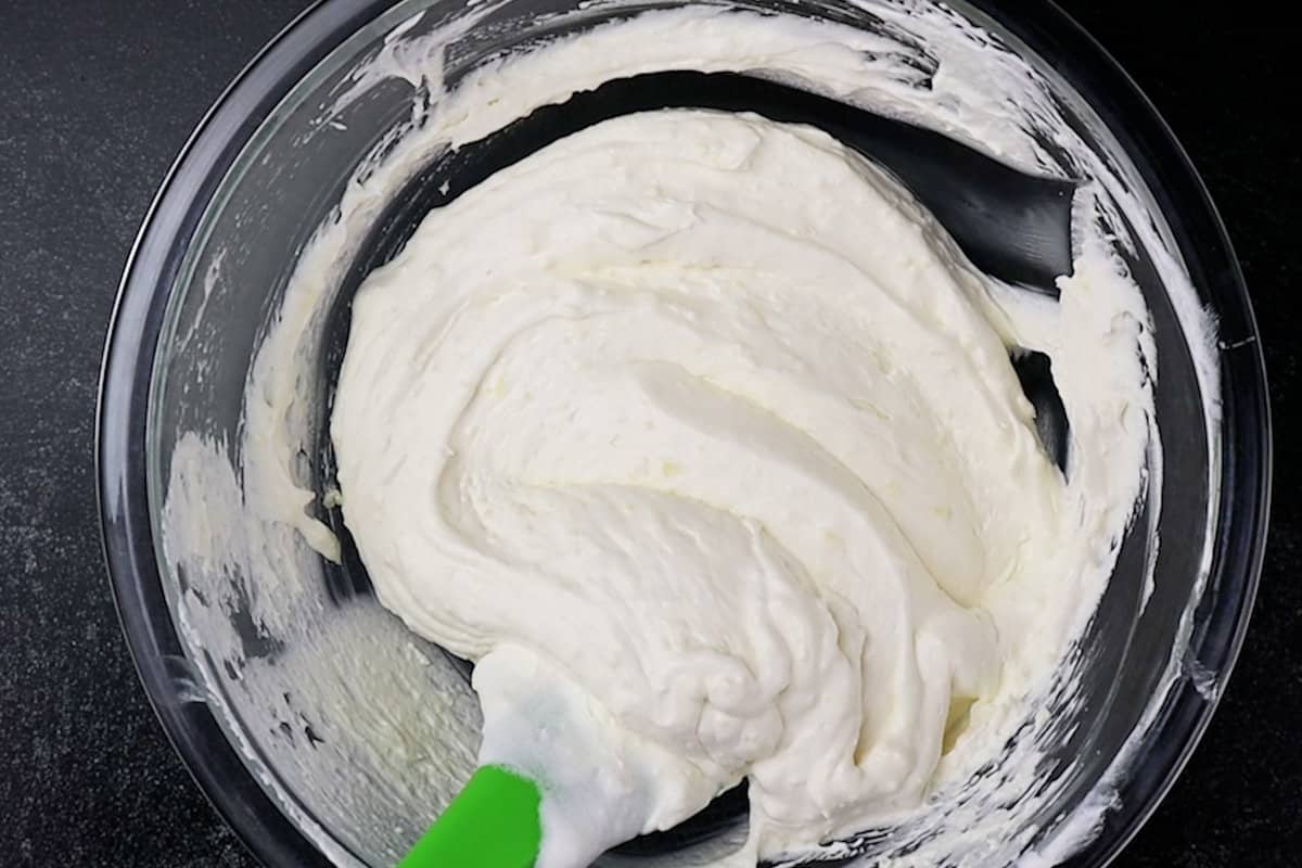 folding in whipped topping to pudding