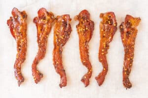 brown sugared bacon on parchement paper