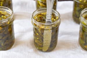 removing air from the jars with a butter knife