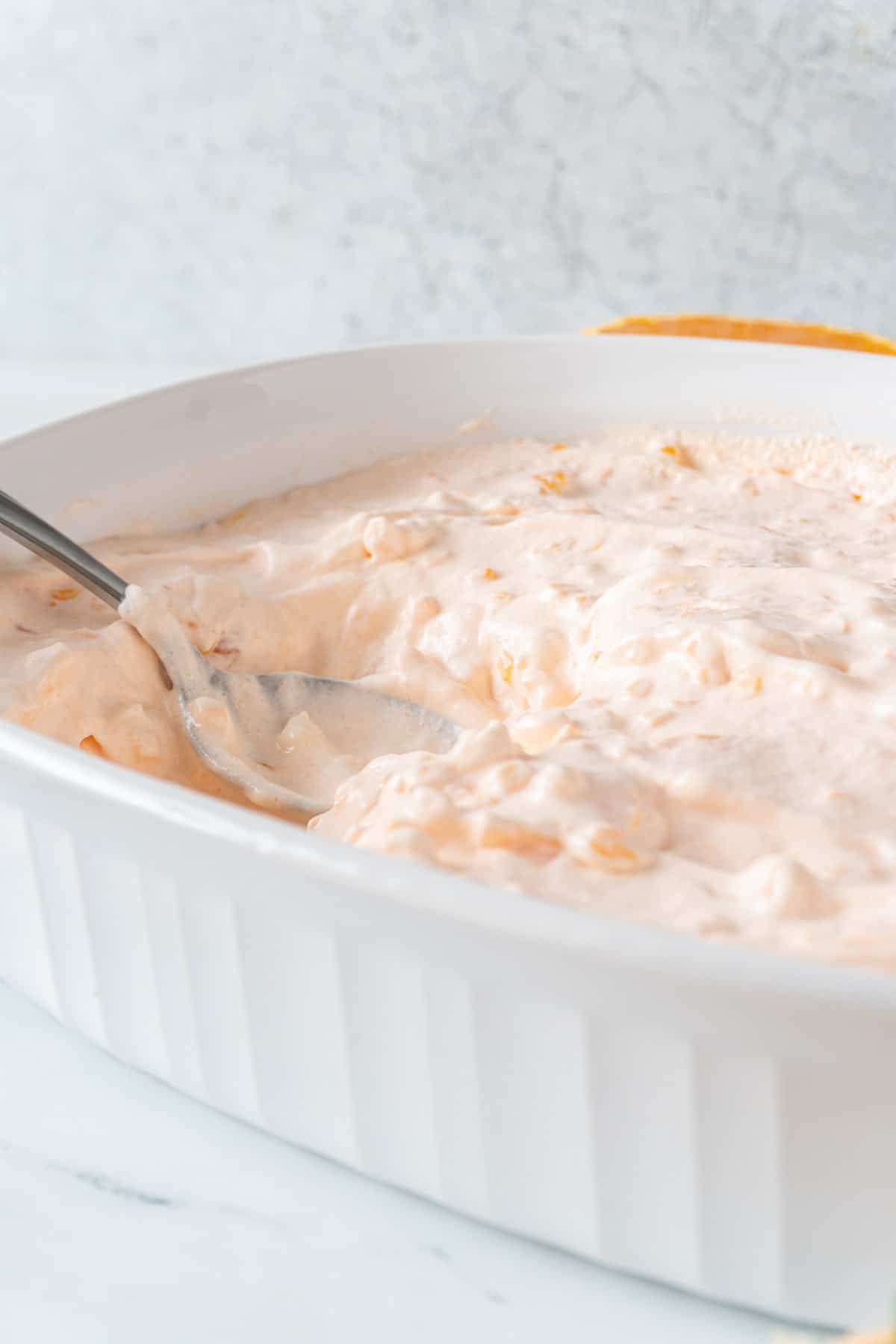 mandarin orange salad with spoon in dish