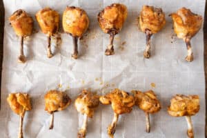 baked chicken lollipops on baking sheet - no sauce added