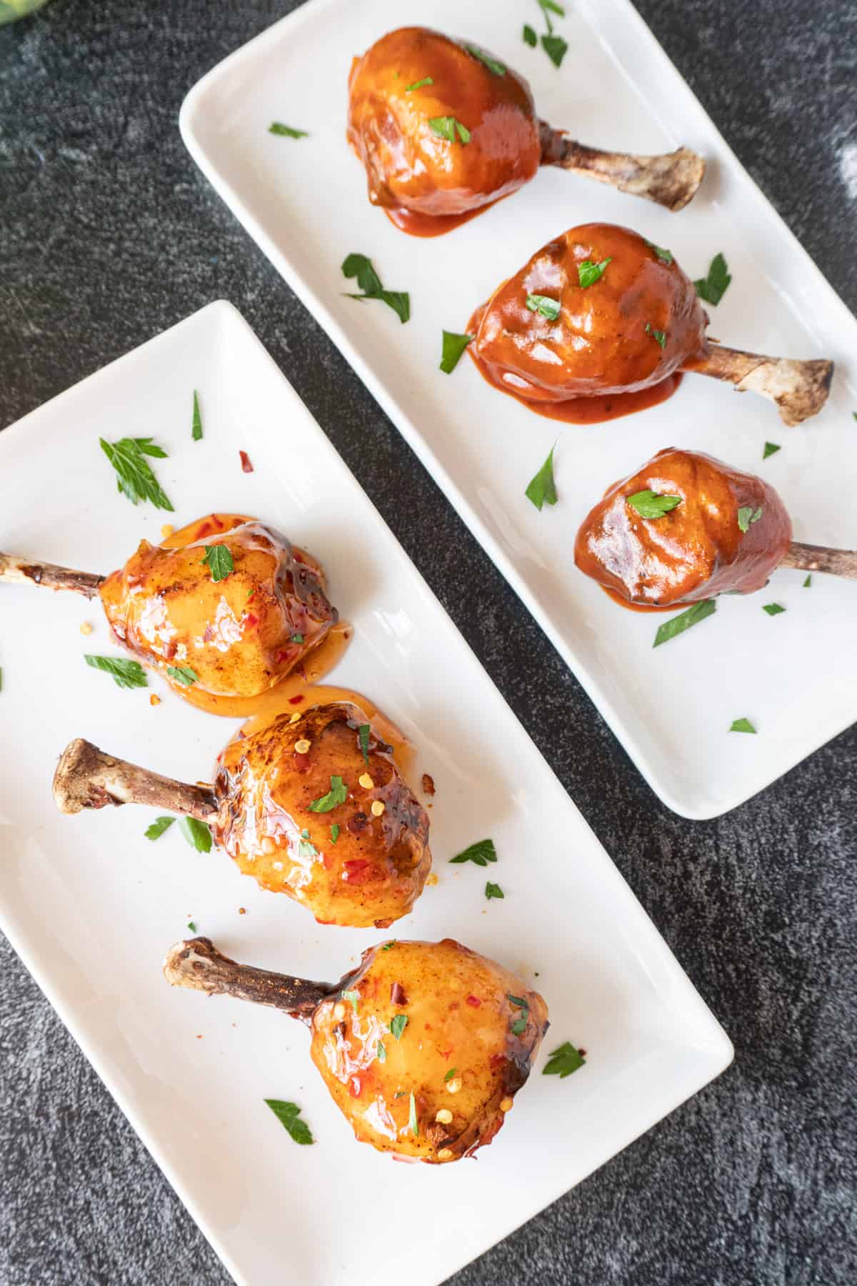 chicken lollipops on white platters