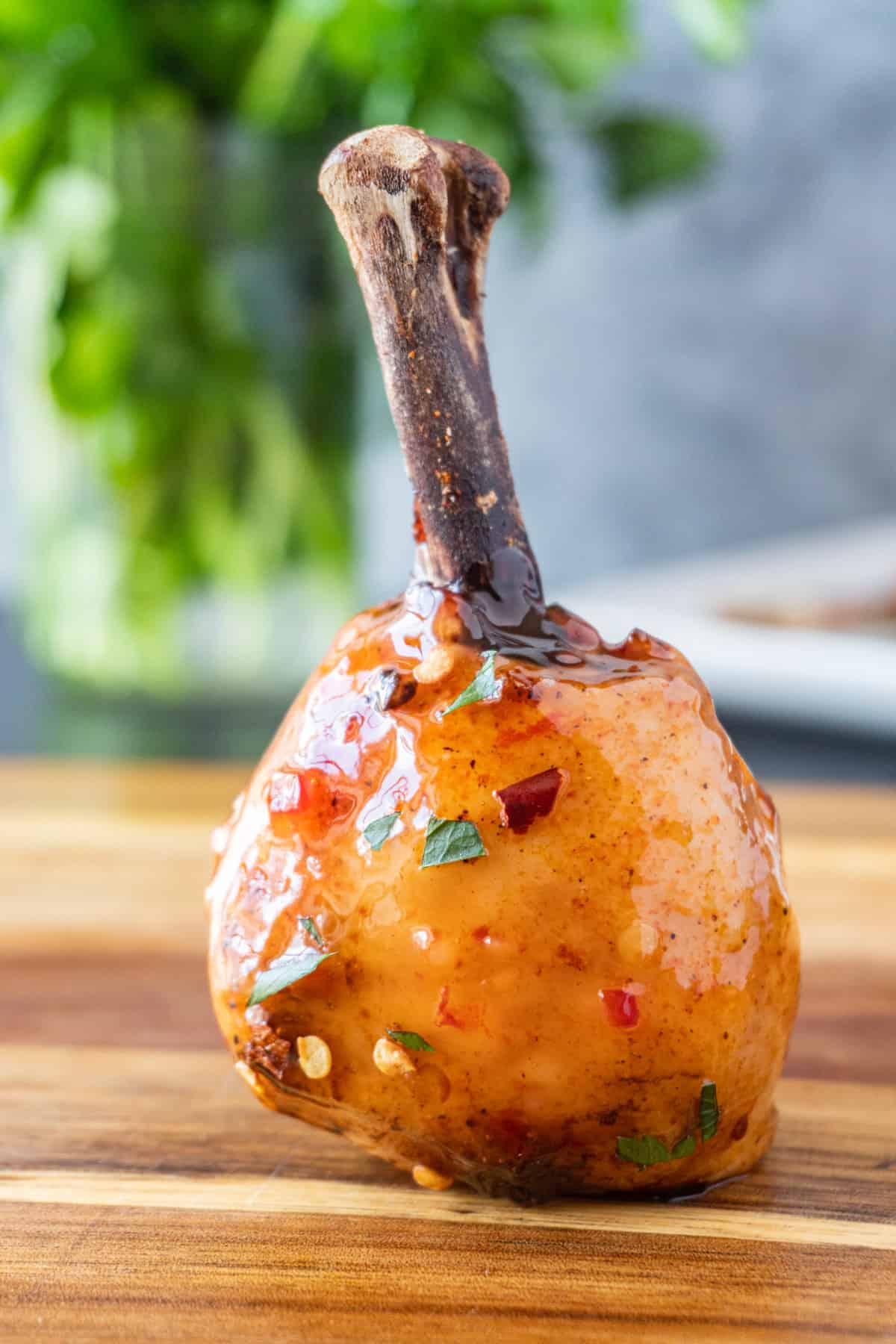 close up of chicken lollipop on cutting board