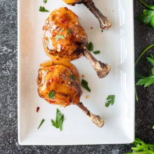 Asian sauce dipped chicken lollipop on plate