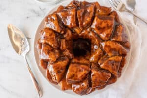 cinnamon pull apart on plate with serving spoon next to it