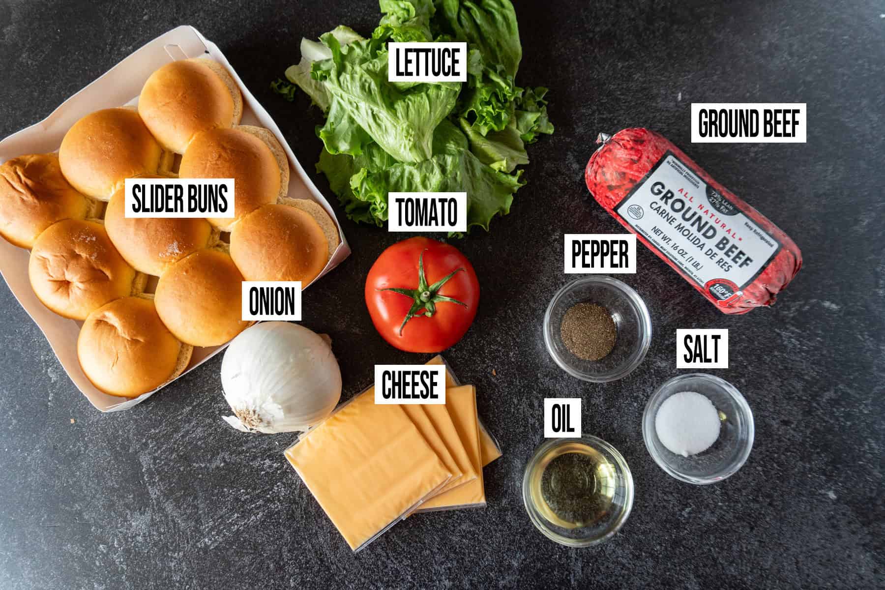 Hamburger sliders ingredients in individual bowls and labeled.