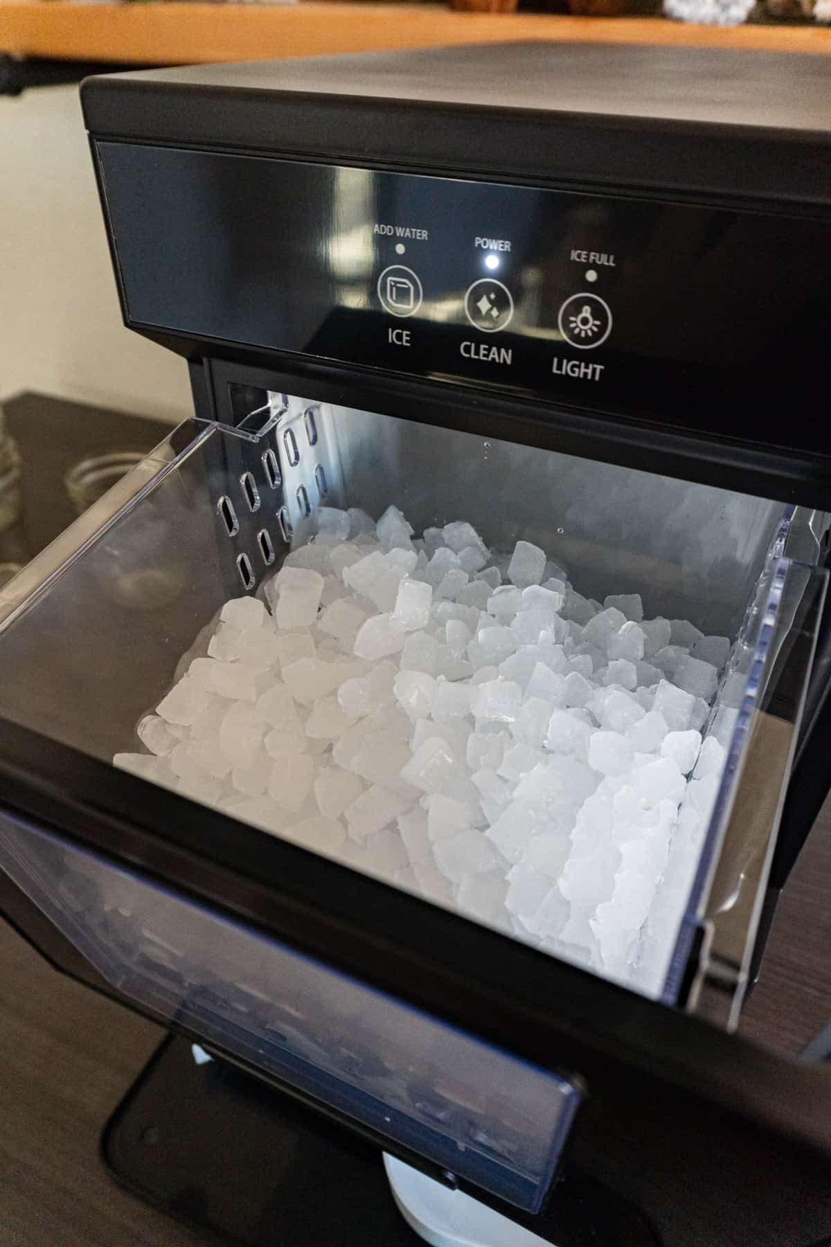 nugget ice maker drawer pulled out showing ice