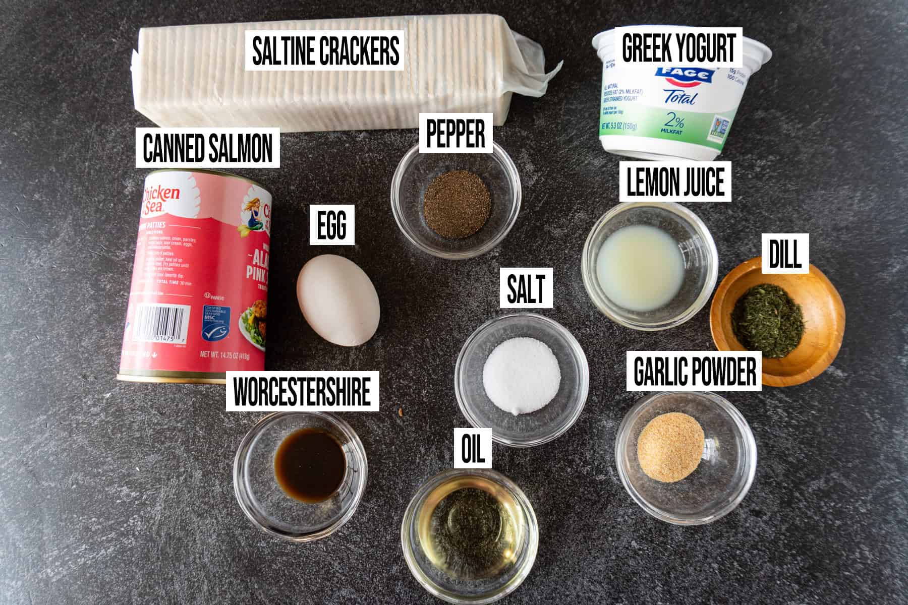 salmon patty ingredients in individual bowls and labeled.