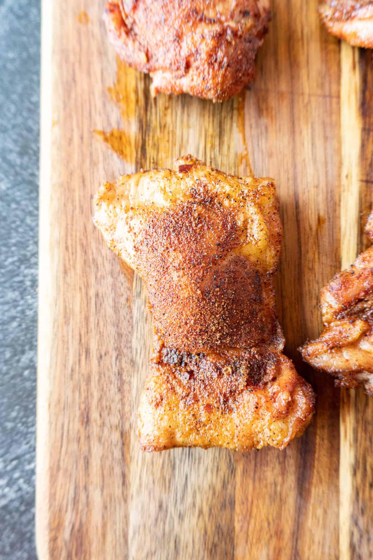 smoked chicken thigh
on cutting board