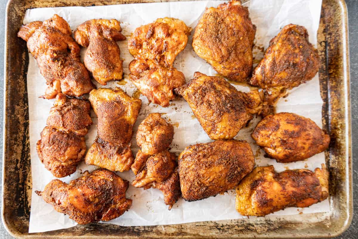 cooked smoked chicken thighs on baking sheet