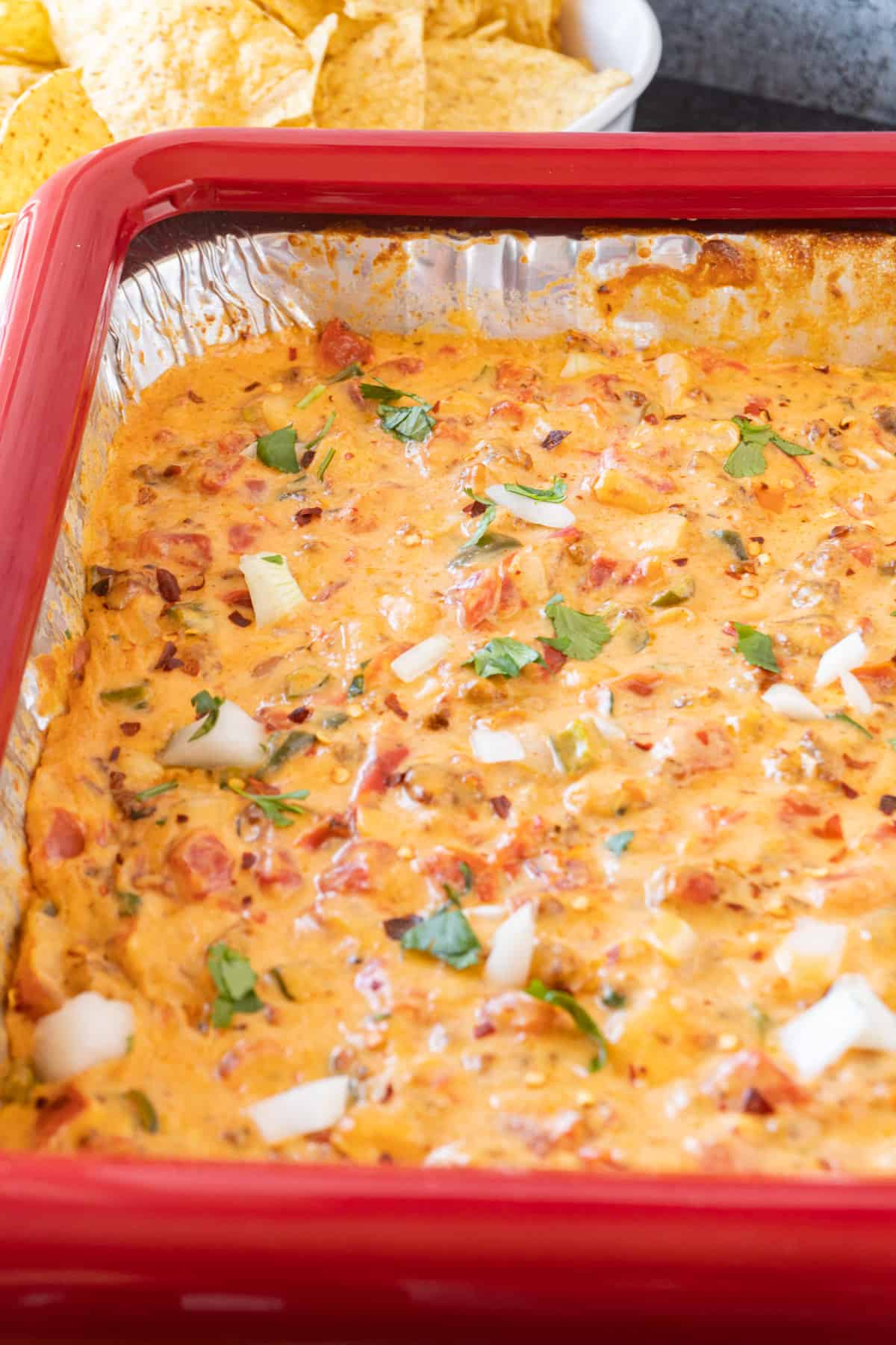 Smoked Queso with chips near pan