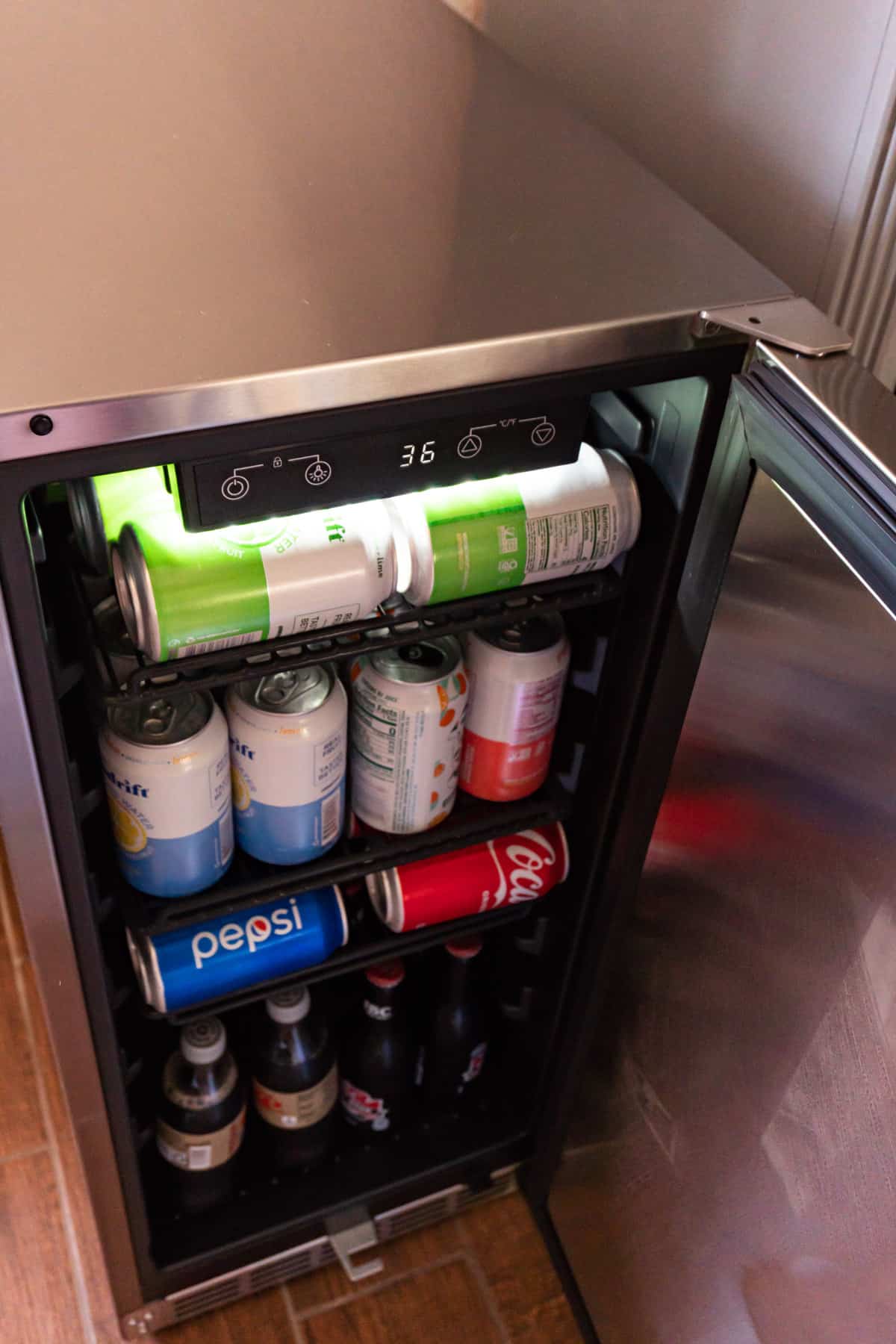 newair beverage fridge open with drinks inside