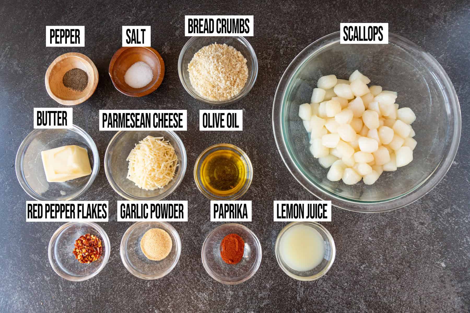 baked scallops ingredients in individual bowls and labeled.