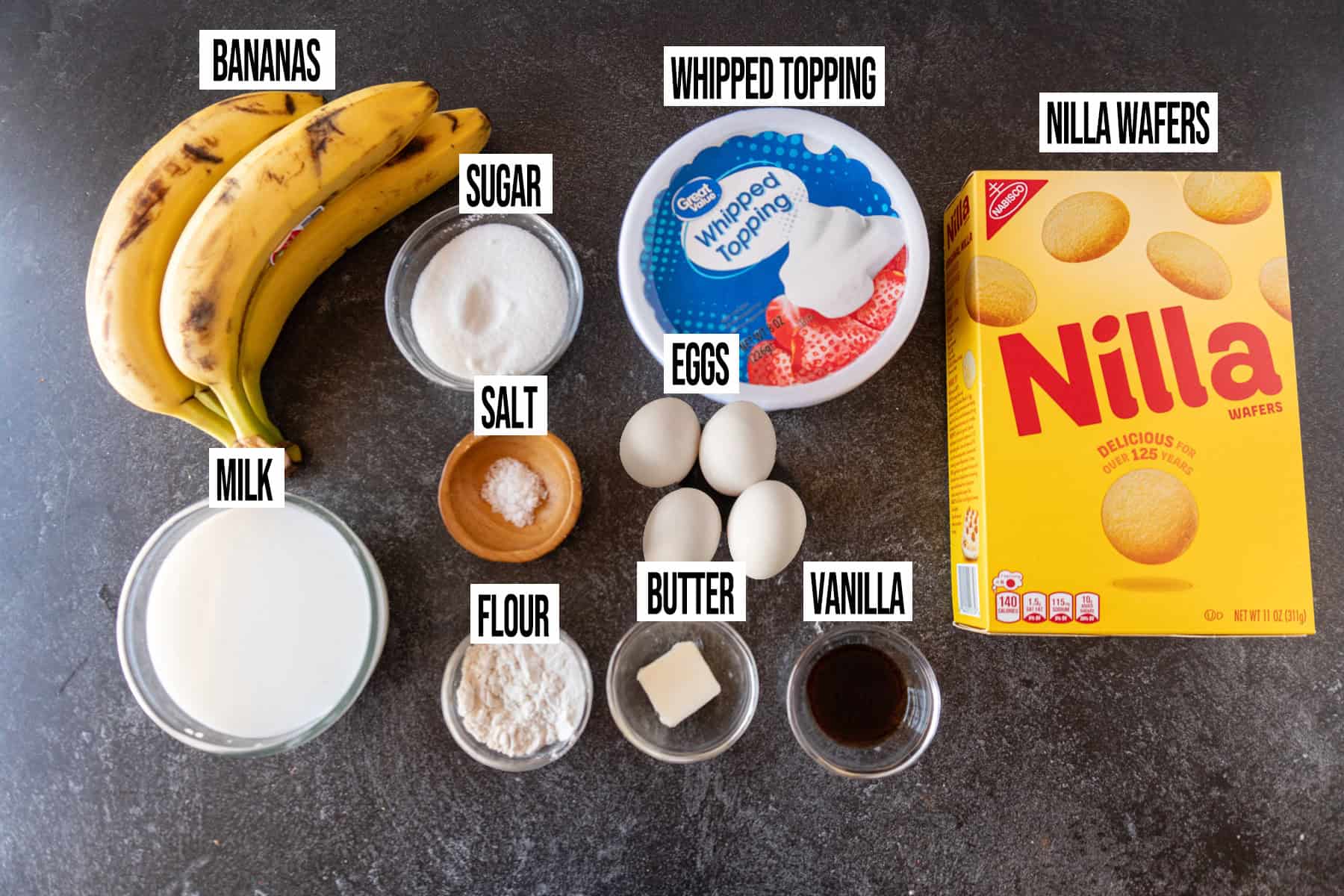 Banana Pudding Ingredients laid out in individual bowls and labeled.