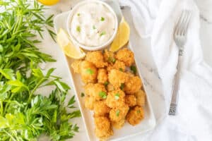 fried scallops on white platter