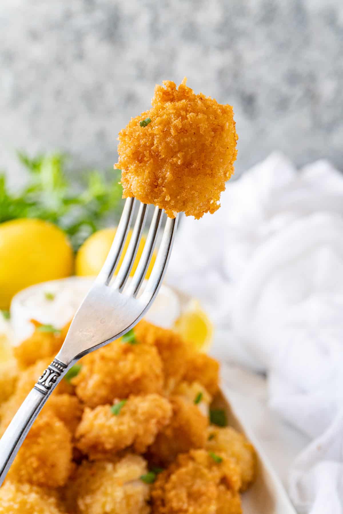 fried scallop on fork