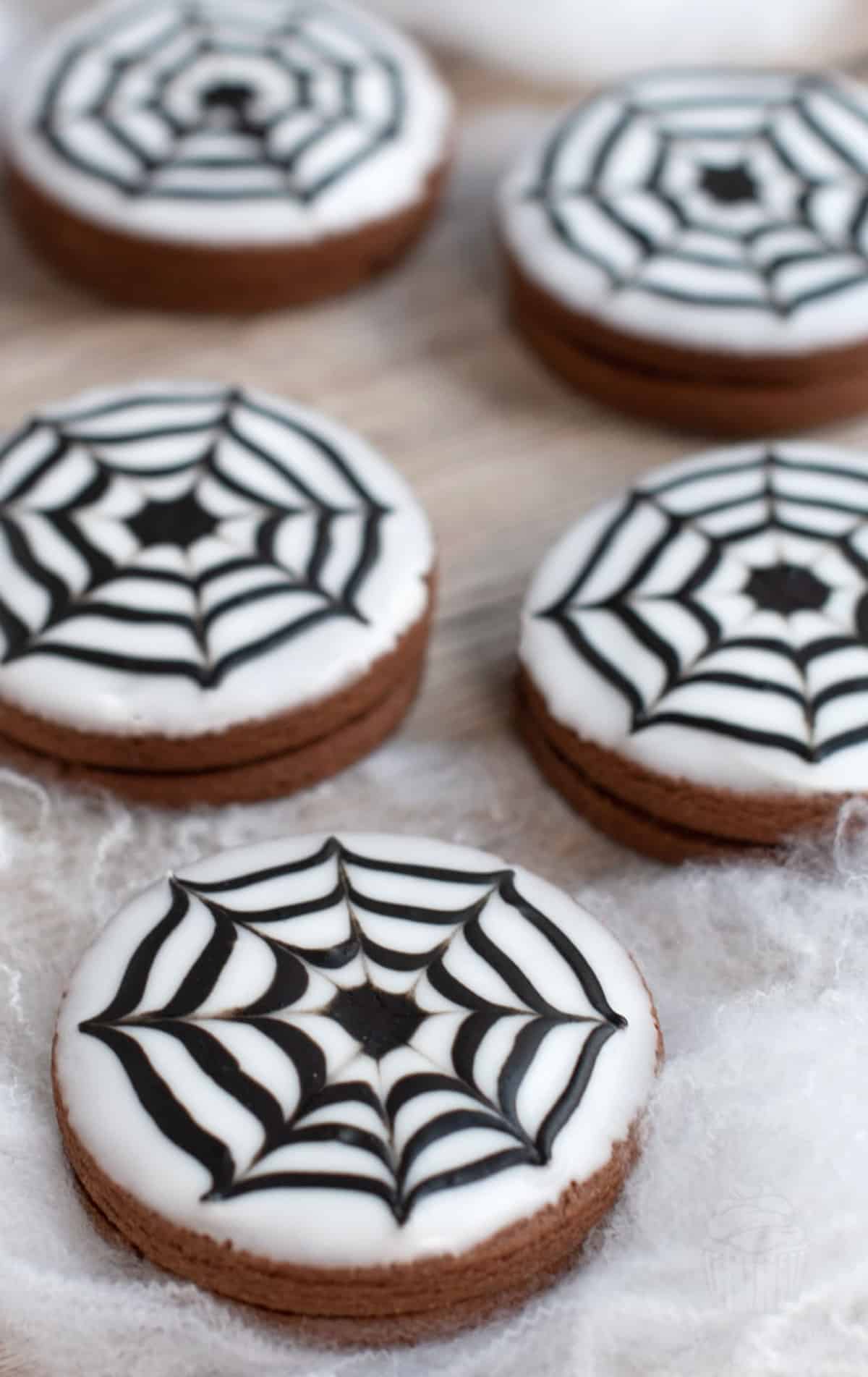 white and black spiderweb cookies