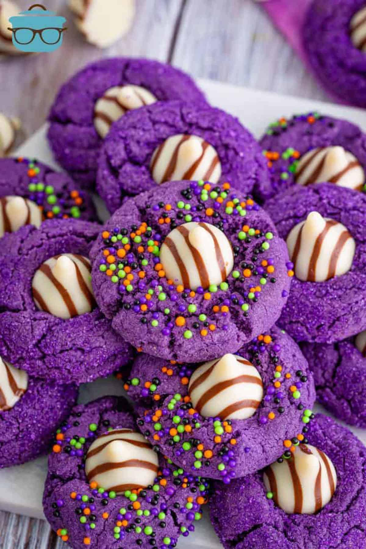 purple witches hat cookies in a pile