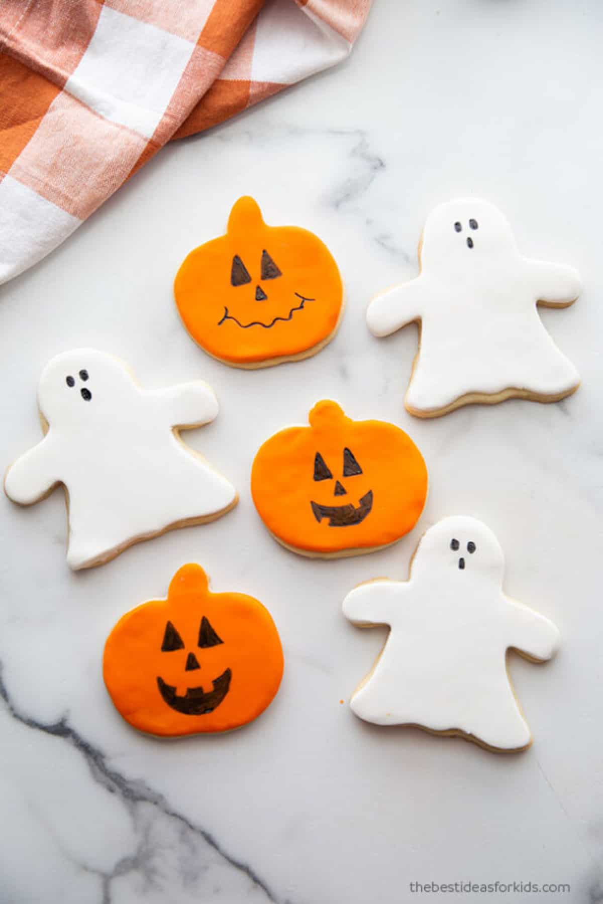 sugar cookies that look like ghosts and pumpkins