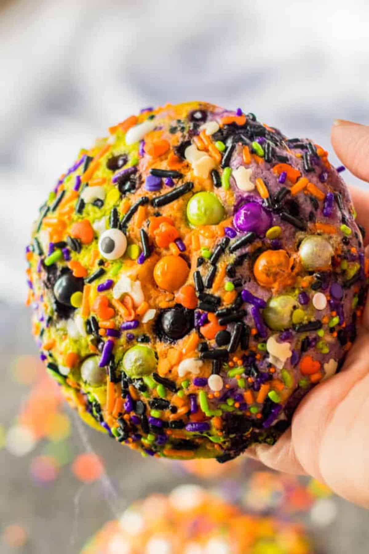Halloween sprinkle cookies that are orange, green and purple