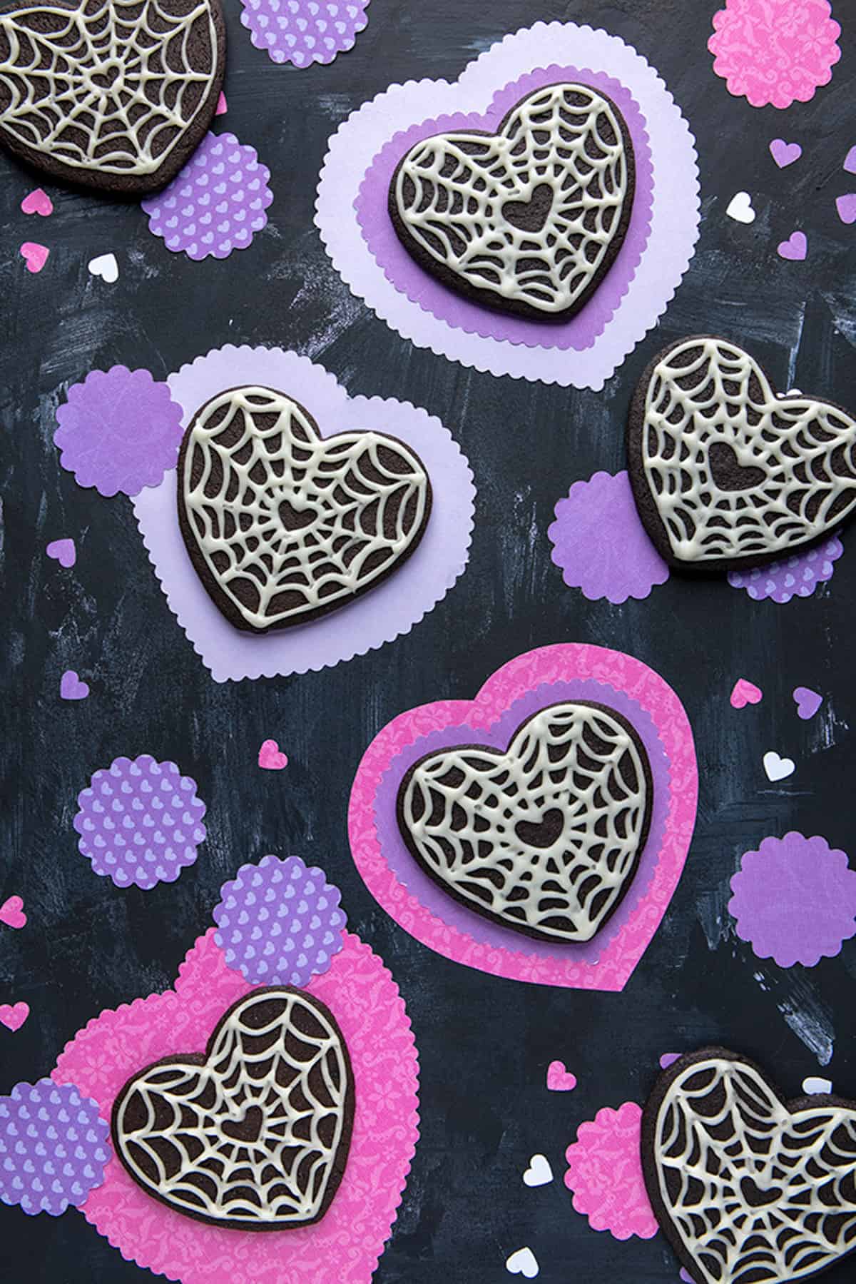 black heart cookies with white spiderwebs