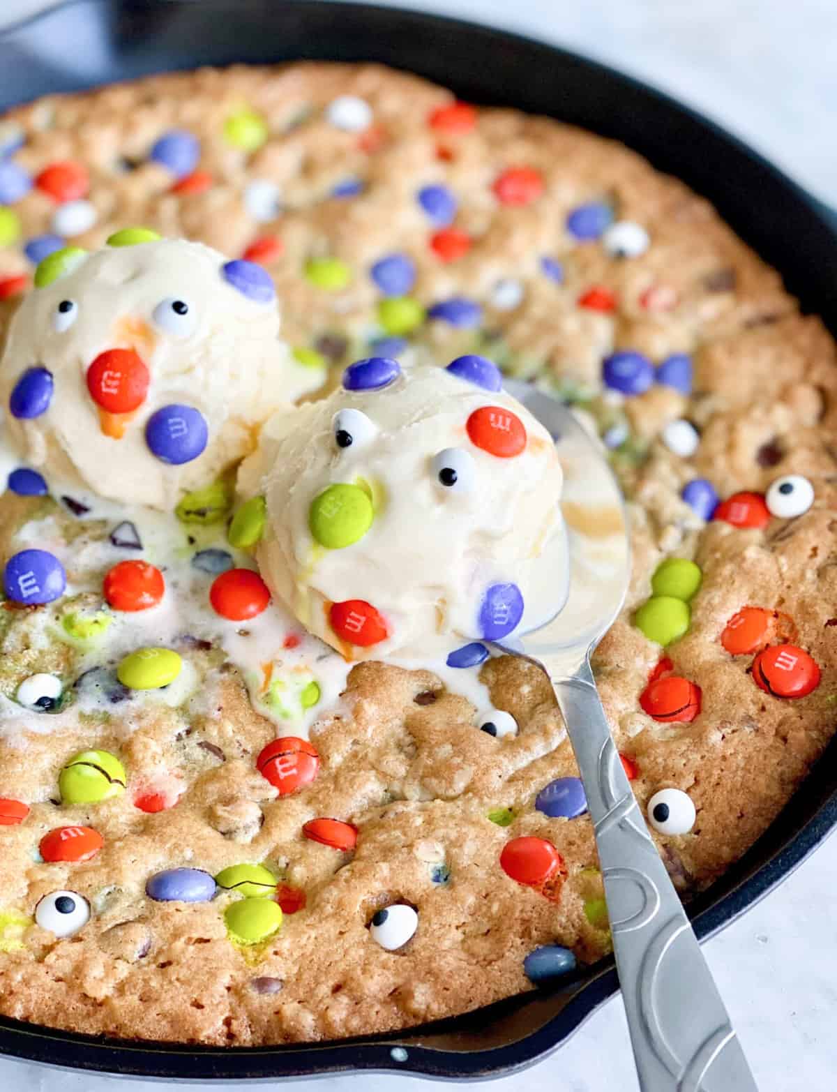 cookie skillet with Halloween candy and candy eyes