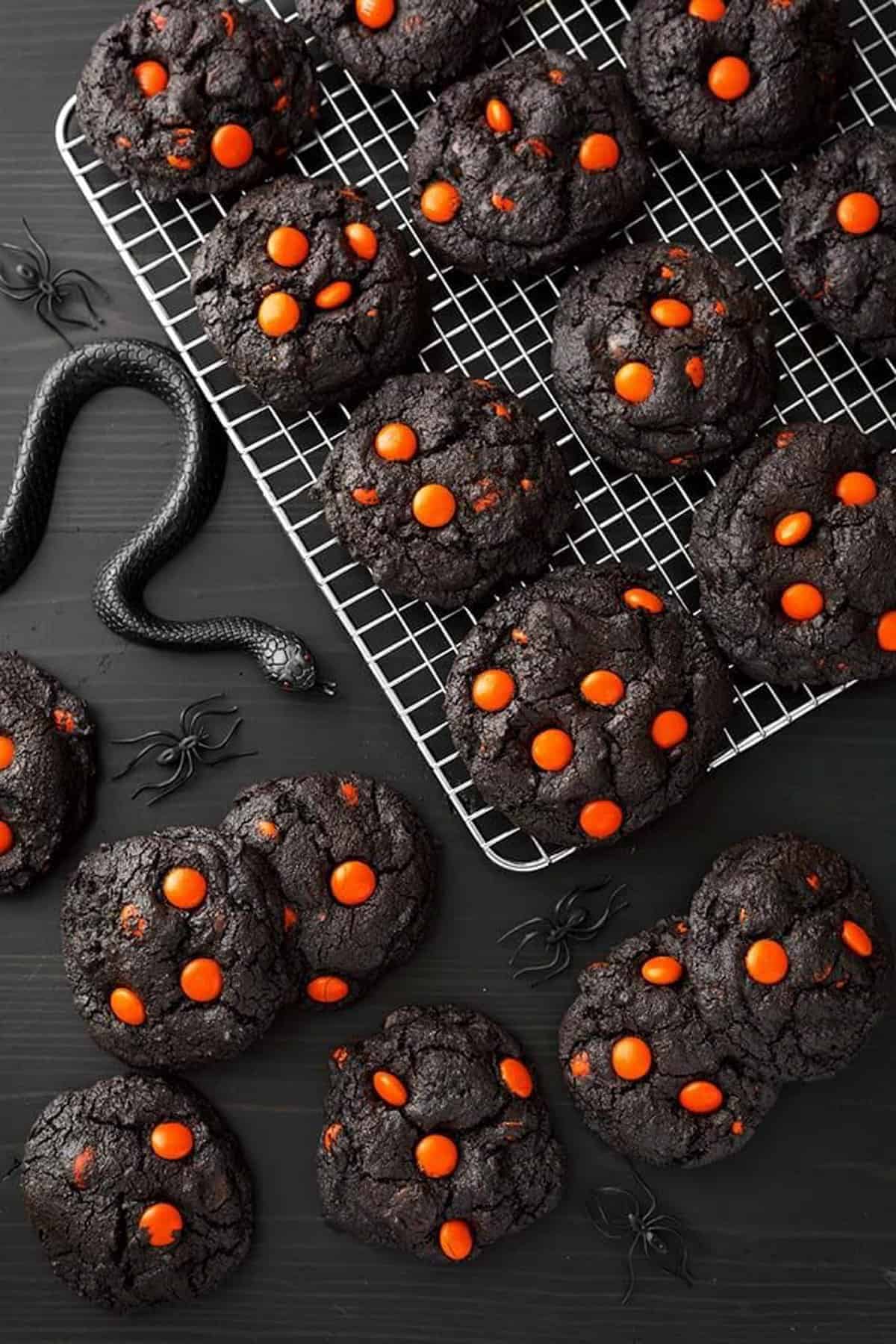black cocoa cookies with orange M&Ms