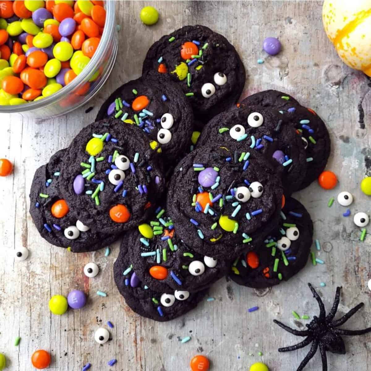 black cookies with colorful Halloween candies