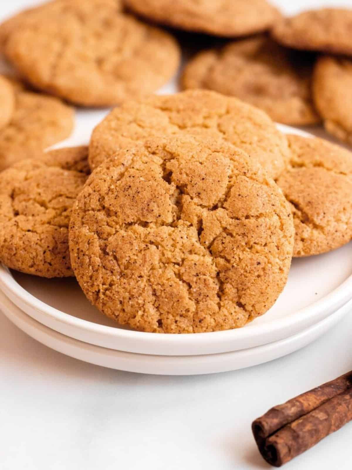 pumpkin snickerdoodles cookies on white plates