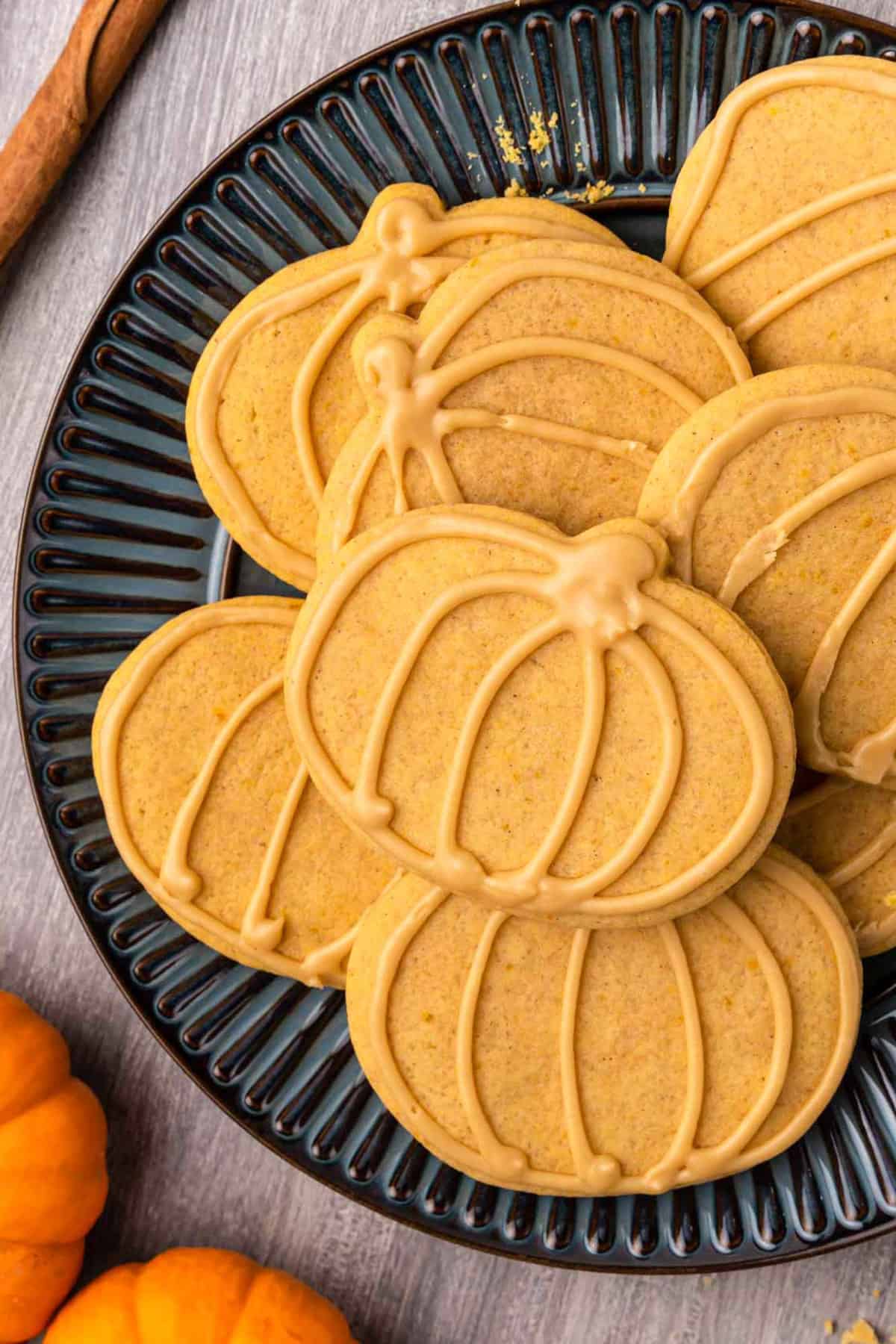cutout pumpkin sugar cookies with maple glaze