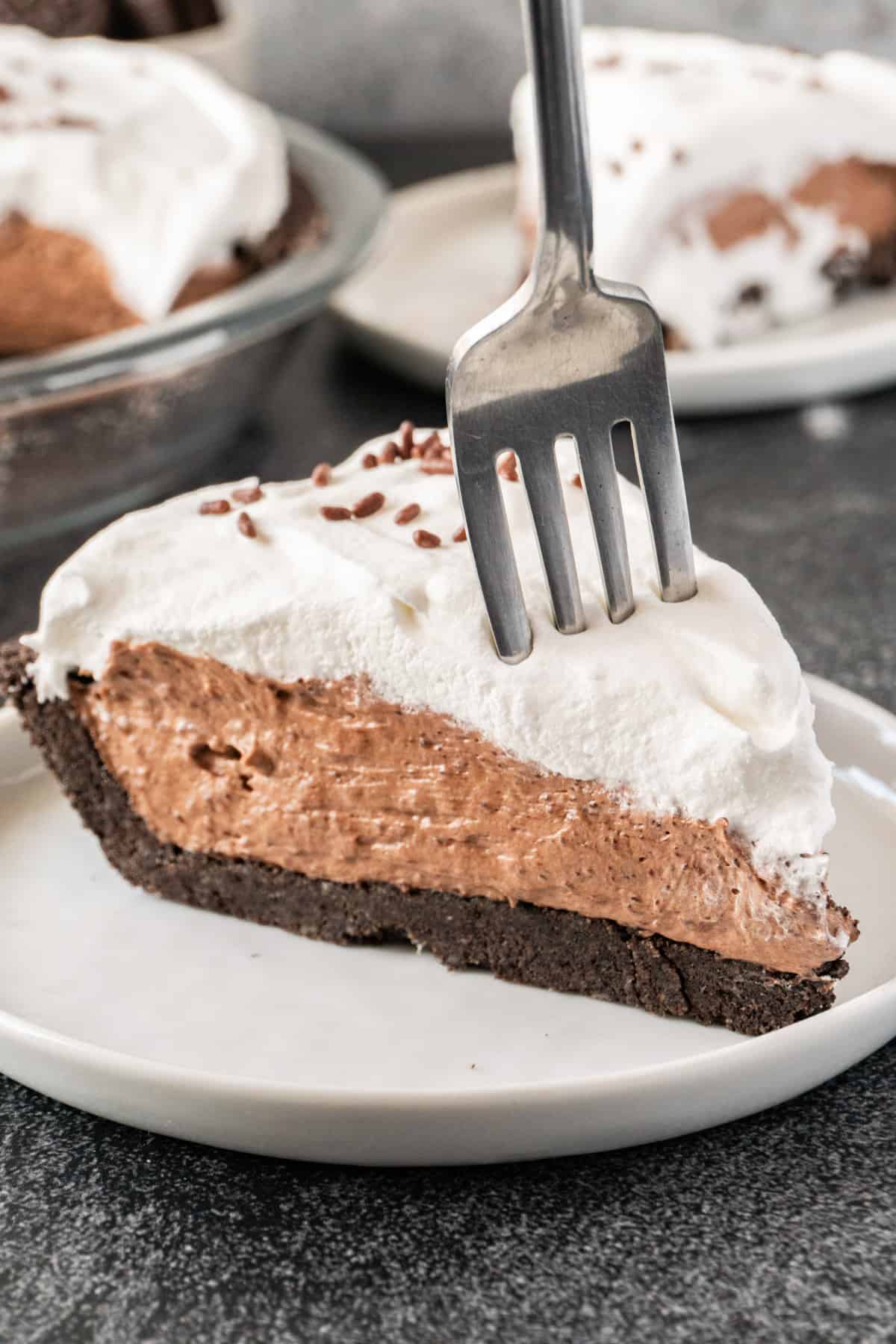 fork stuck into slice of pie