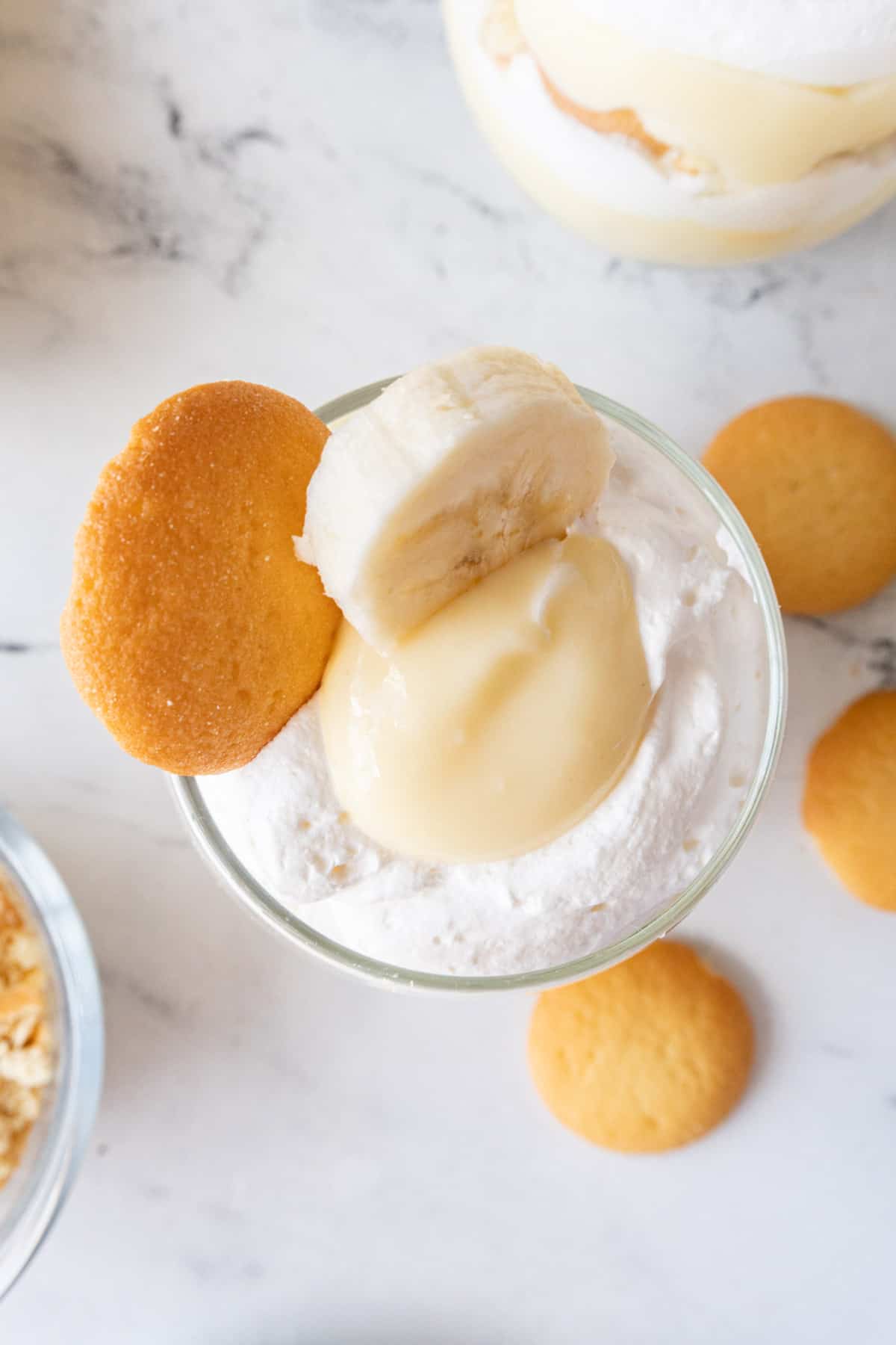 top of pudding cup with banana slice and cookie