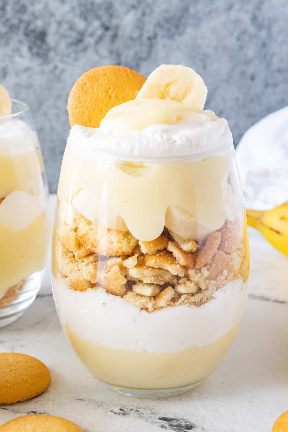 close up of layered banana pudding in cup